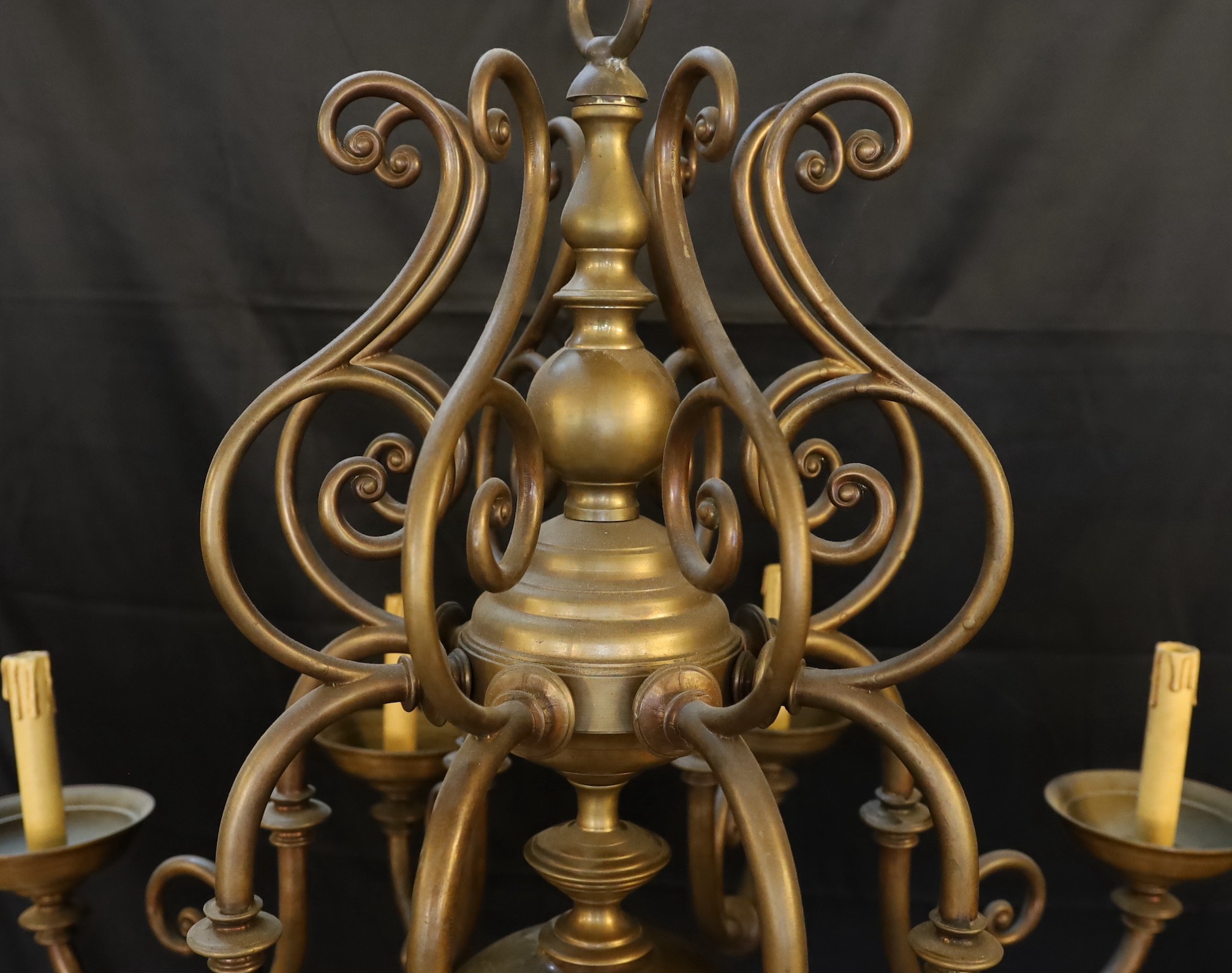 An early 20th century 17th century Dutch style brass eight light chandelier, height 82cm width 82cm